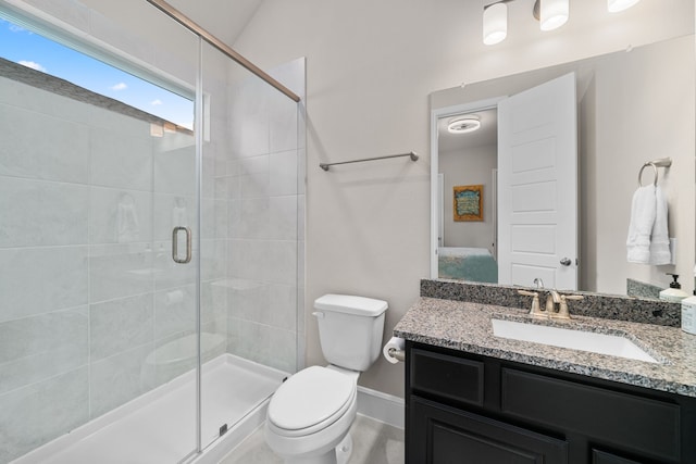 bathroom with toilet, a shower with shower door, hardwood / wood-style flooring, and vanity