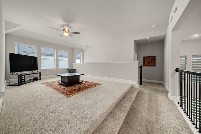 living room featuring ceiling fan and carpet flooring