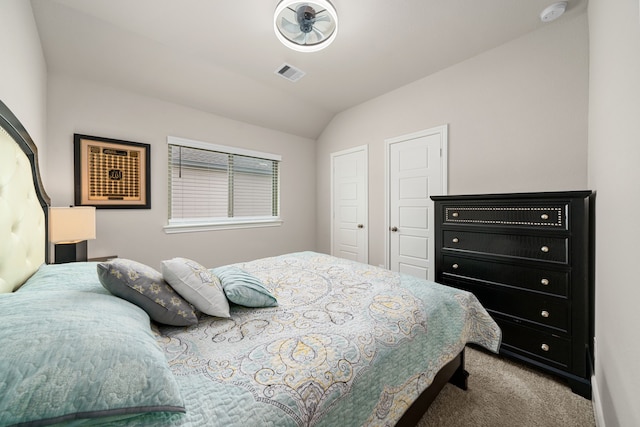 bedroom featuring carpet floors and vaulted ceiling