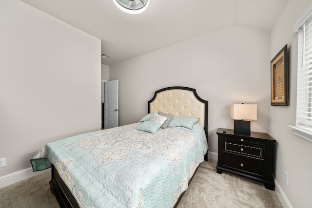 carpeted bedroom featuring vaulted ceiling