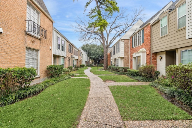 view of community featuring a lawn