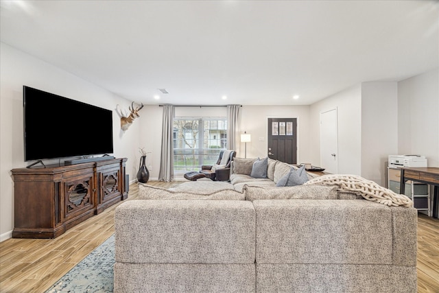 living room with light hardwood / wood-style flooring