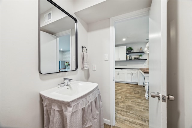 bathroom featuring hardwood / wood-style floors