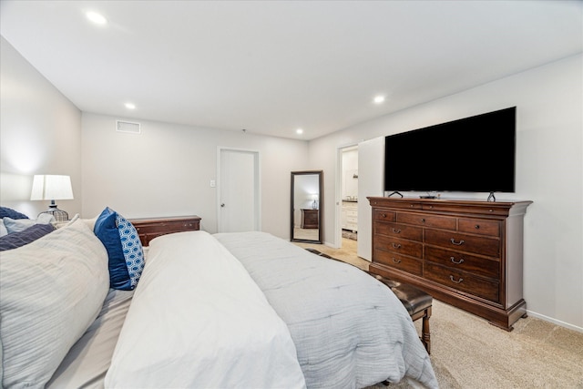 bedroom featuring light carpet