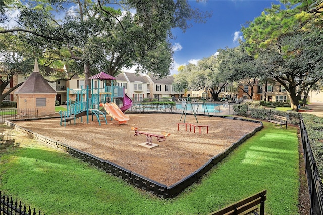 view of play area featuring a community pool