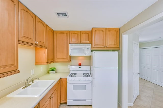 kitchen featuring crown molding, sink, and white appliances