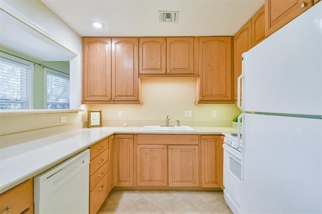 kitchen with light tile patterned floors, sink, and white appliances