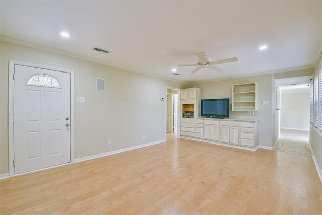 unfurnished living room with light wood-type flooring, ceiling fan, and crown molding