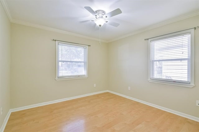 empty room featuring ceiling fan, crown molding, light hardwood / wood-style floors, and plenty of natural light