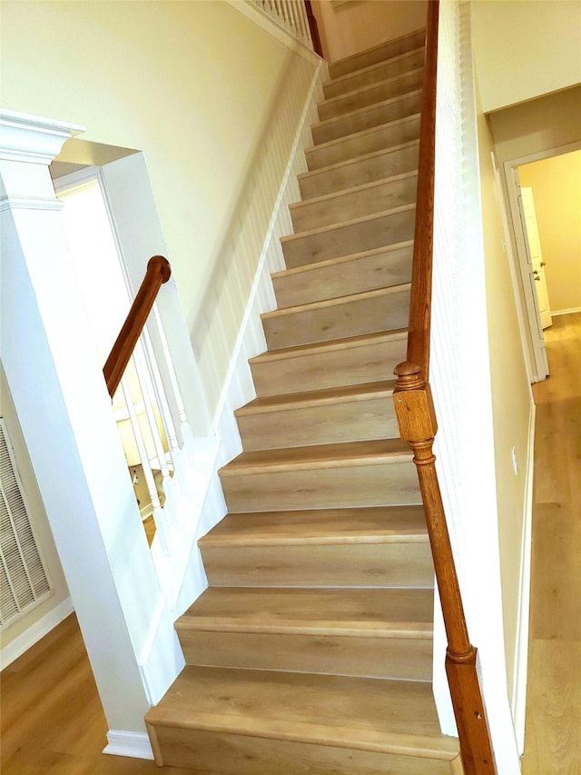 staircase featuring wood-type flooring