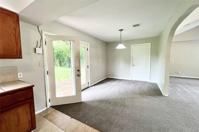 entryway featuring light carpet