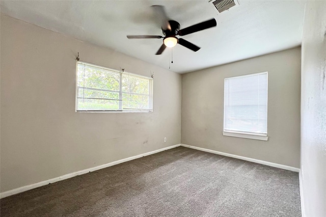 carpeted empty room featuring ceiling fan