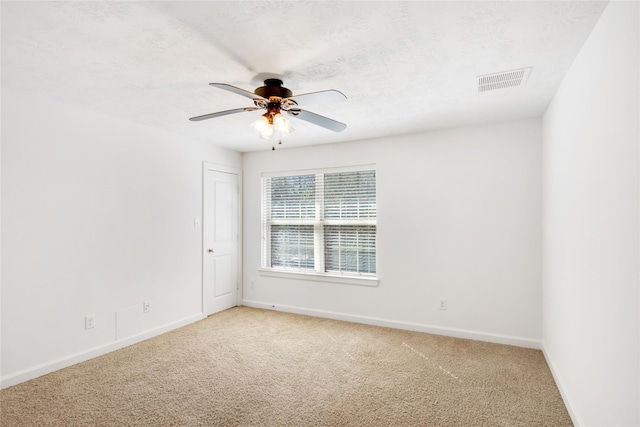 unfurnished room featuring carpet floors and ceiling fan