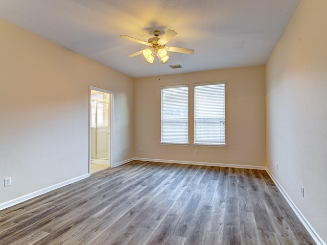 empty room featuring ceiling fan and wood-type flooring