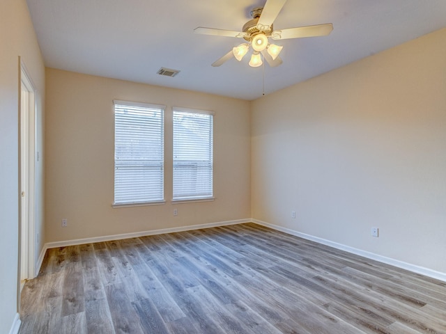 unfurnished room featuring ceiling fan and wood-type flooring