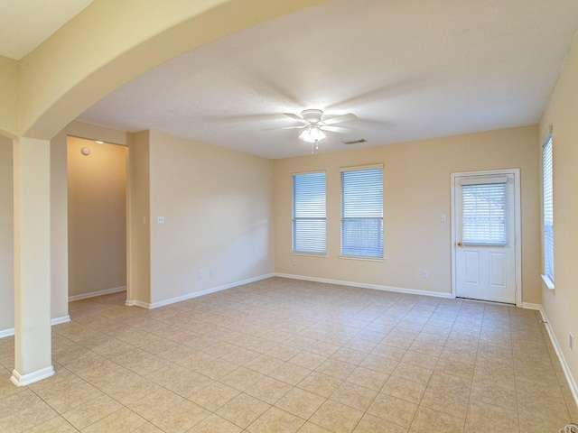 interior space with ceiling fan