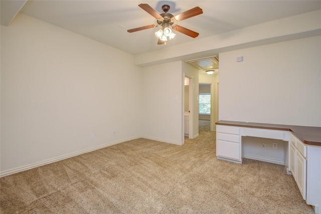 carpeted empty room with ceiling fan