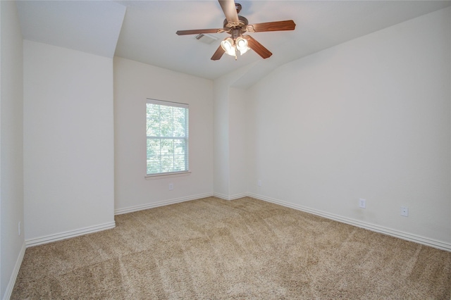 spare room featuring light carpet and ceiling fan