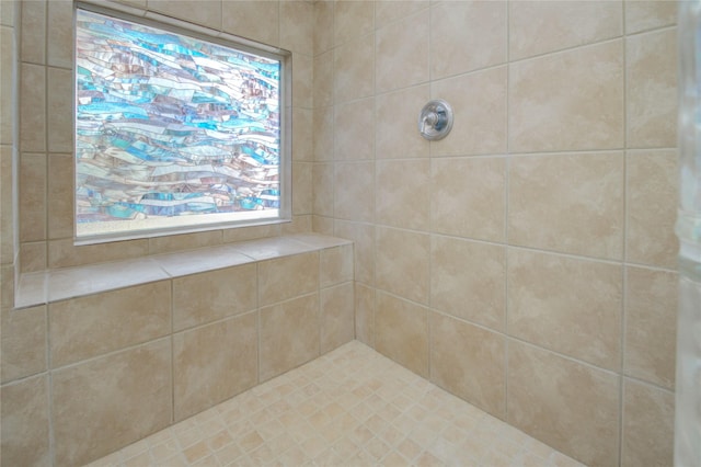 bathroom featuring a tile shower