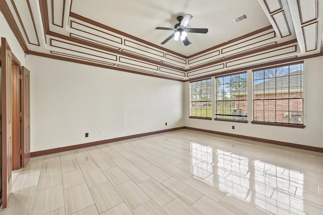 unfurnished room with ceiling fan and crown molding