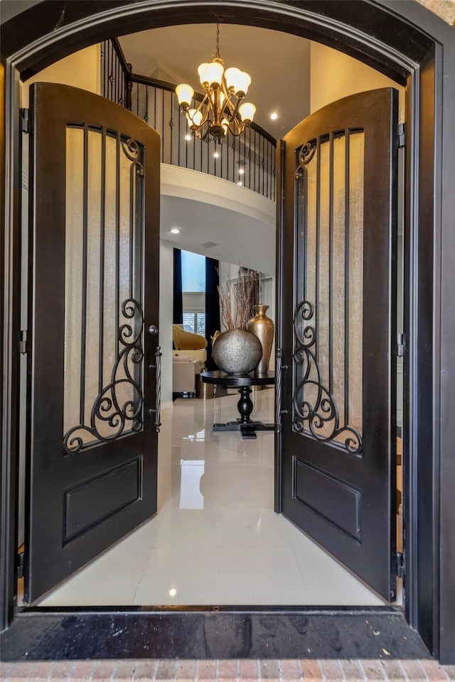 foyer featuring a chandelier