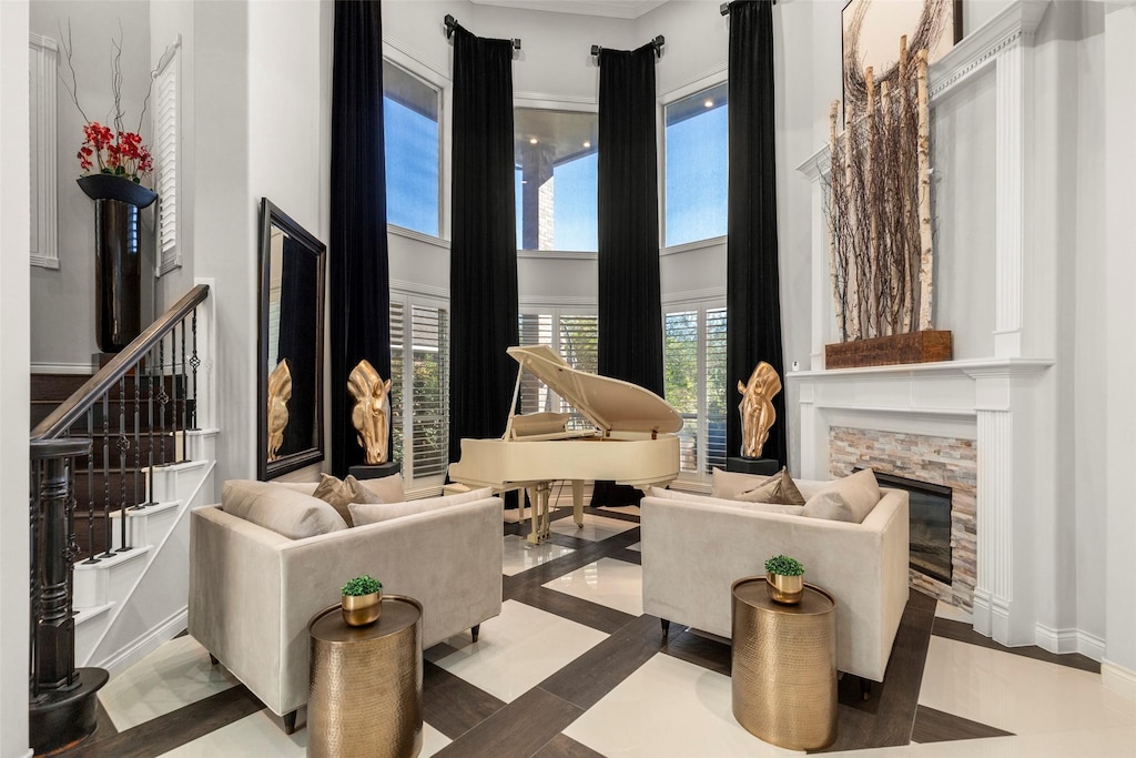 living area featuring tile patterned flooring and a towering ceiling