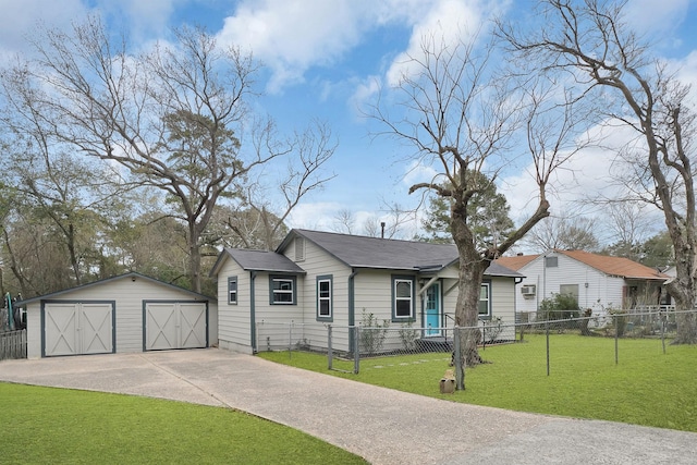 view of front of property featuring an outbuilding, a garage, and a front yard