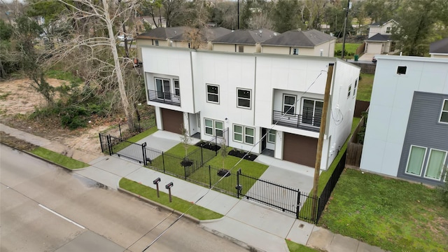 view of front of house with a garage and a balcony