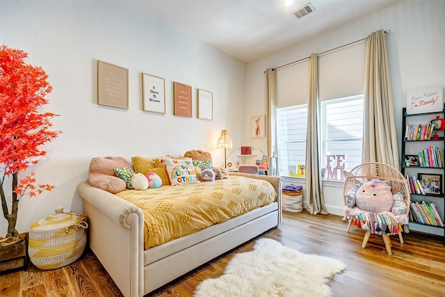 bedroom with wood-type flooring