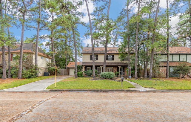 view of front facade with a garage and a front yard