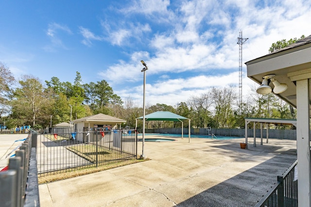 exterior space with a gazebo and a fenced in pool