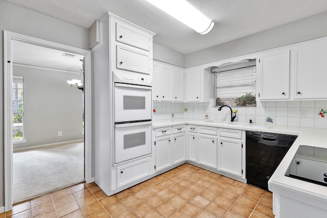 kitchen with white cabinetry, black dishwasher, light colored carpet, double oven, and sink