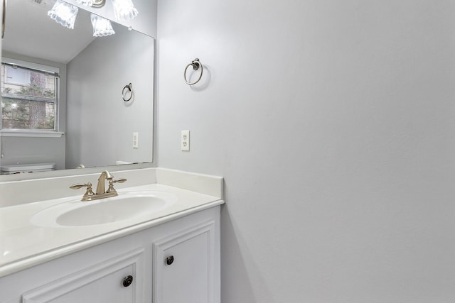 bathroom with toilet and vanity