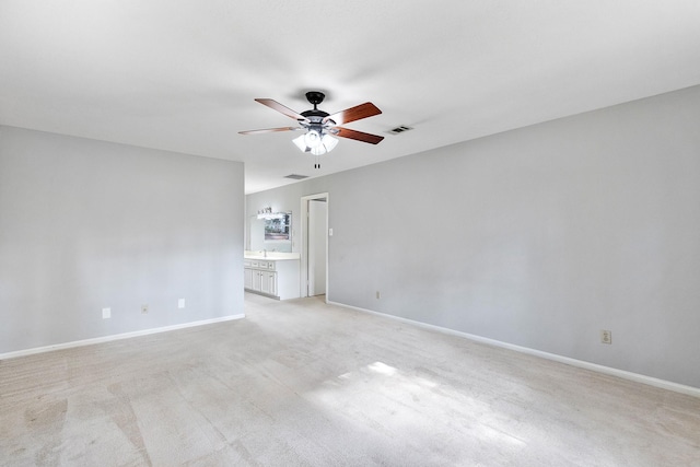 carpeted empty room with ceiling fan