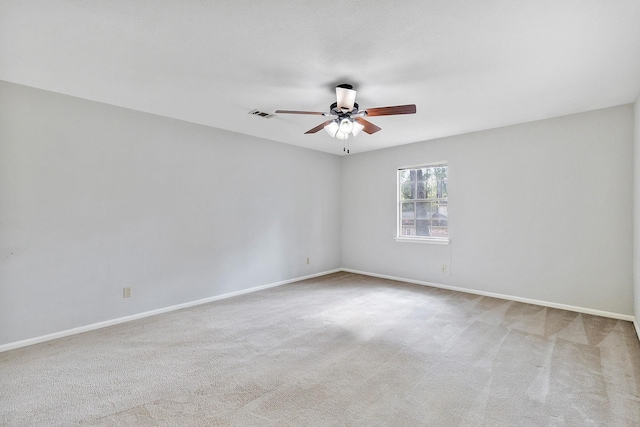 unfurnished room with light carpet