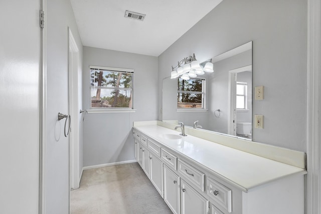 bathroom with toilet and vanity