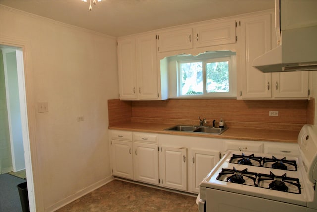 kitchen with tasteful backsplash, white range with gas stovetop, sink, and white cabinetry