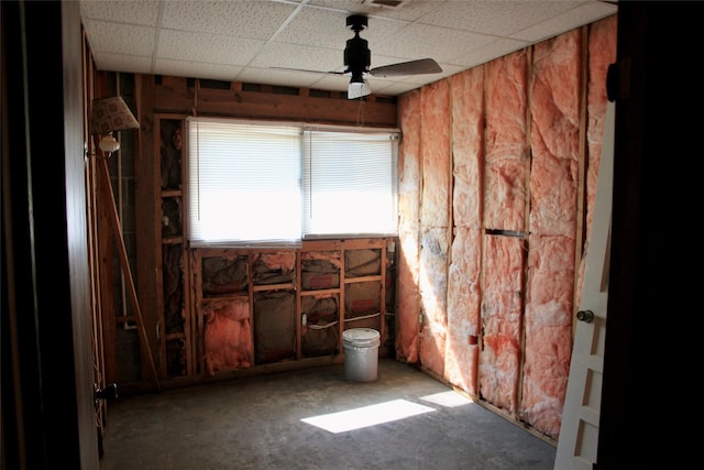 miscellaneous room with ceiling fan and a paneled ceiling