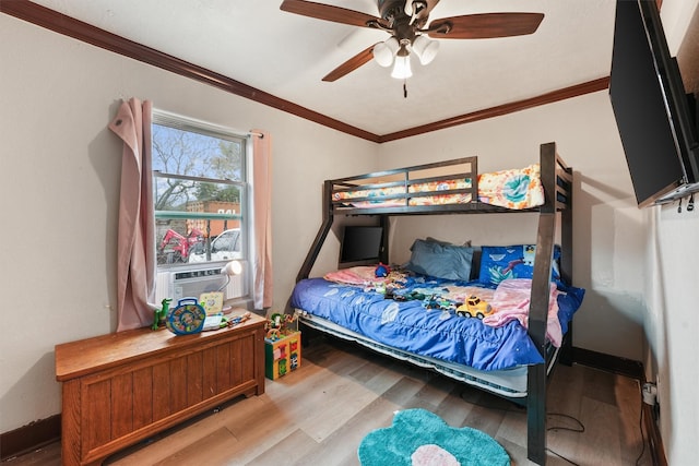 bedroom with ceiling fan, cooling unit, hardwood / wood-style flooring, and crown molding