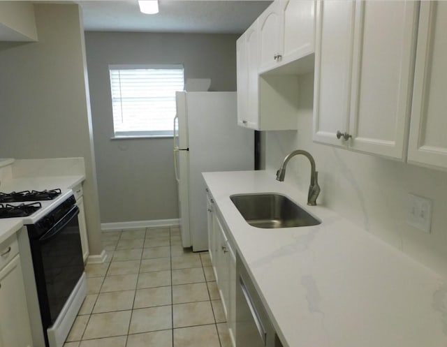 kitchen featuring white cabinetry, light tile patterned flooring, dishwasher, range with gas stovetop, and sink