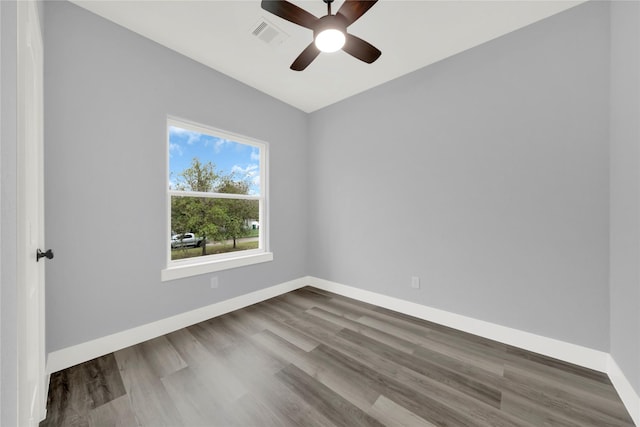 empty room featuring ceiling fan and hardwood / wood-style flooring