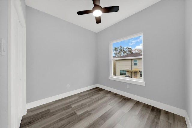 empty room featuring ceiling fan and wood-type flooring