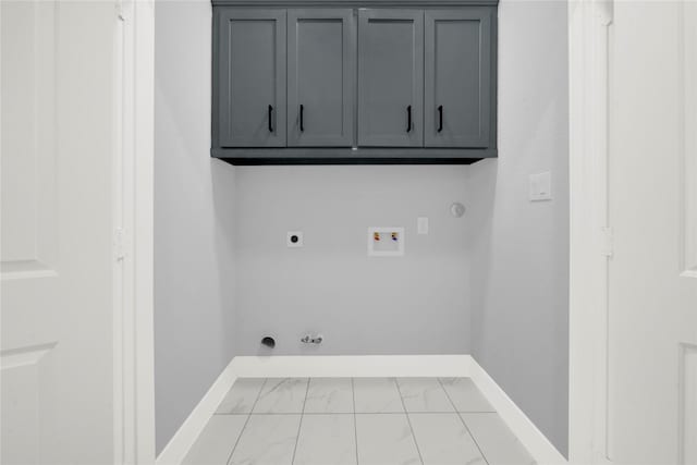 clothes washing area featuring hookup for a gas dryer, washer hookup, hookup for an electric dryer, and cabinets