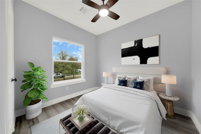 bedroom featuring ceiling fan and hardwood / wood-style flooring