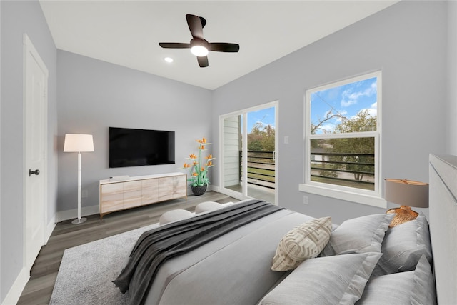 bedroom with ceiling fan, dark hardwood / wood-style flooring, and access to exterior