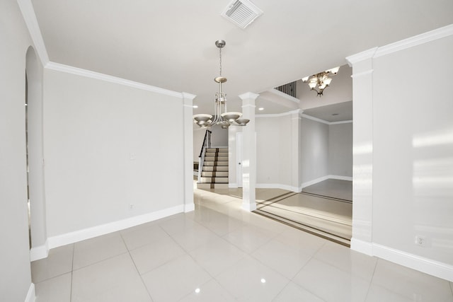 unfurnished room with tile patterned flooring, an inviting chandelier, and crown molding