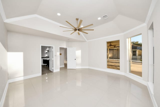 tiled empty room featuring a raised ceiling, ceiling fan, crown molding, and lofted ceiling