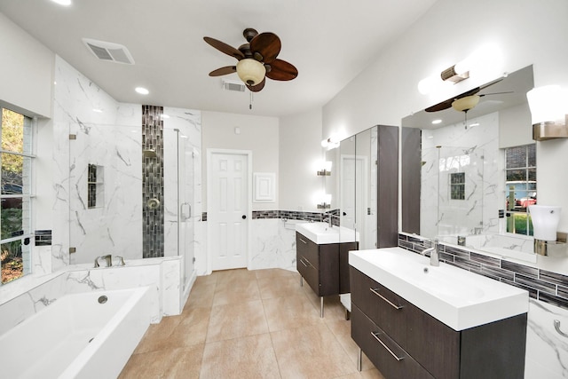 bathroom with ceiling fan, vanity, and shower with separate bathtub