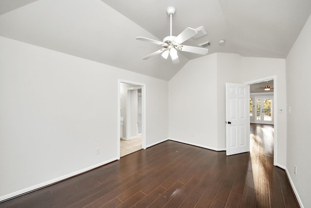 unfurnished room featuring dark wood-type flooring, ceiling fan, and lofted ceiling