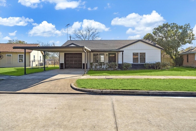 ranch-style home featuring a front lawn, a carport, and a garage